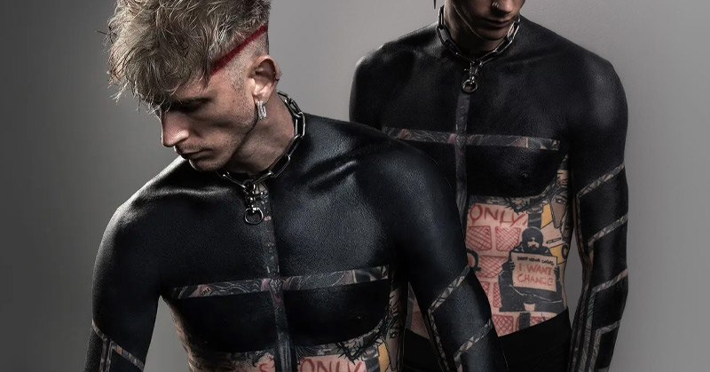 Machine Gun Kelly covers his upper body with blackout tattoo